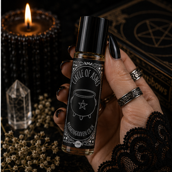 Circle of Ashes perfume oil in a 10ml roller bottle with gothic cauldron artwork by Roaming Raven.