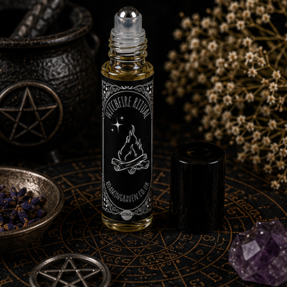 Witchfire Ritual perfume oil in a 10ml roller bottle with gothic campfire artwork by Roaming Raven.