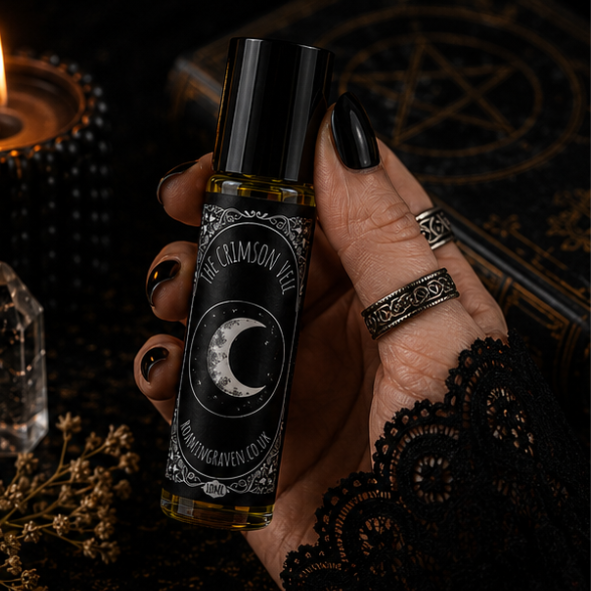 Crimson Veil perfume oil in a 10ml roller bottle with luxury Book of Shadows gift box by Roaming Raven.