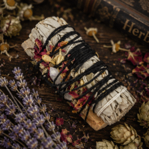 White Sage Smudge Stick wrapped with rose petals, jasmine flowers and clear quartz crystal for cleansing rituals by Roaming Raven
