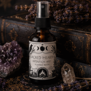 Sacred Hearth intention mist handcrafted with essential oils in an amber glass spray bottle by Roaming Raven