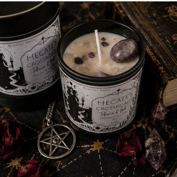 Hecate's Crossroads Tobacco & Oak crystal candle with amethyst moon and crystals on a witchy altar by Roaming Raven