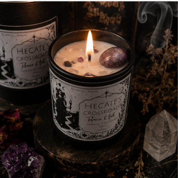 Hecate's Crossroads Tobacco & Oak crystal candle with amethyst moon and crystals on a witchy altar by Roaming Raven