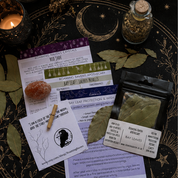 Flat lay of a bay leaf spell kit arranged on a celestial altar cloth with bay leaves, red jade crystal, ritual candle and spell instructions in a magical witchcraft setting.