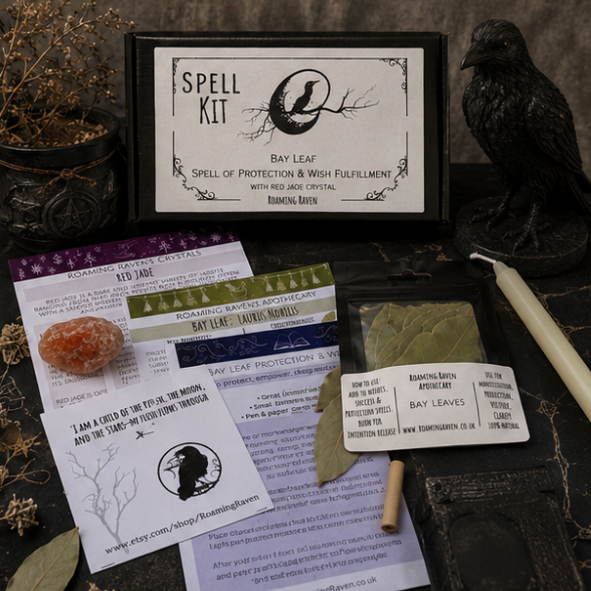 Complete Roaming Raven bay leaf spell kit in gift box with ritual candle, bay leaves, red jade crystal and spell cards displayed beside raven and gothic apothecary decorations.