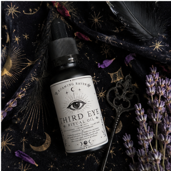 Third Eye Ritual Oil on celestial fabric with antique key, dried lavender and witchcraft accessories.