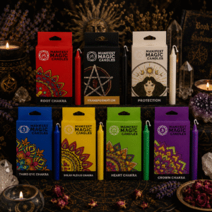 Complete collection of Manifest Magic ritual candles including Root Chakra, Solar Plexus, Heart Chakra, Third Eye, Crown Chakra, Protection and Transformation candles displayed on a mystical witchy altar with crystals and candlelight.