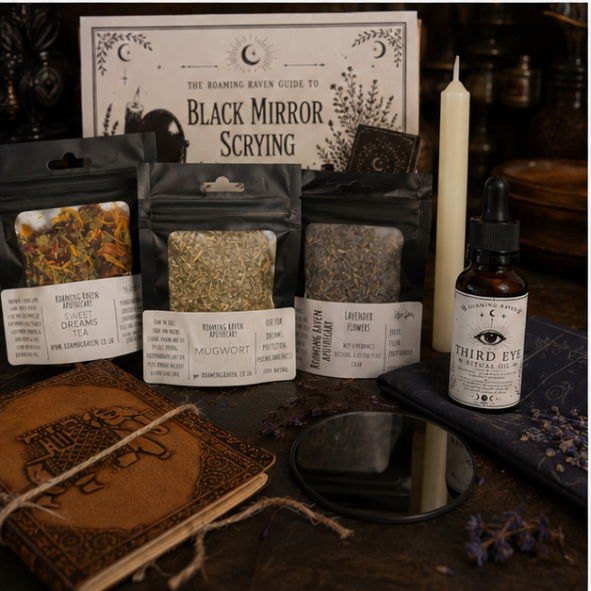 Black Mirror Scrying Kit by Roaming Raven containing a black scrying mirror, Third Eye Ritual Oil, mugwort, lavender, dream tea, ritual candle, altar cloth and illustrated guide.