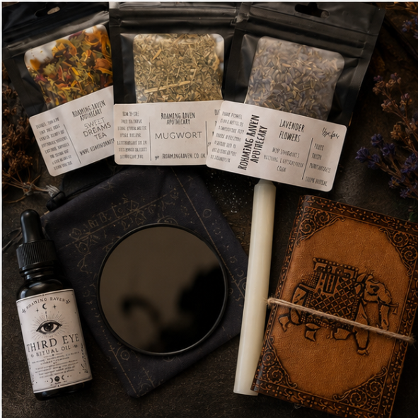Black Mirror Scrying Kit by Roaming Raven containing a black scrying mirror, Third Eye Ritual Oil, mugwort, lavender, dream tea, ritual candle, altar cloth and illustrated guide.