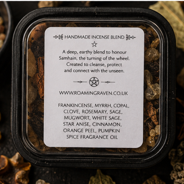 Samhain ritual incense in black tin styled with witchcraft altar accessories, herbs and crystals