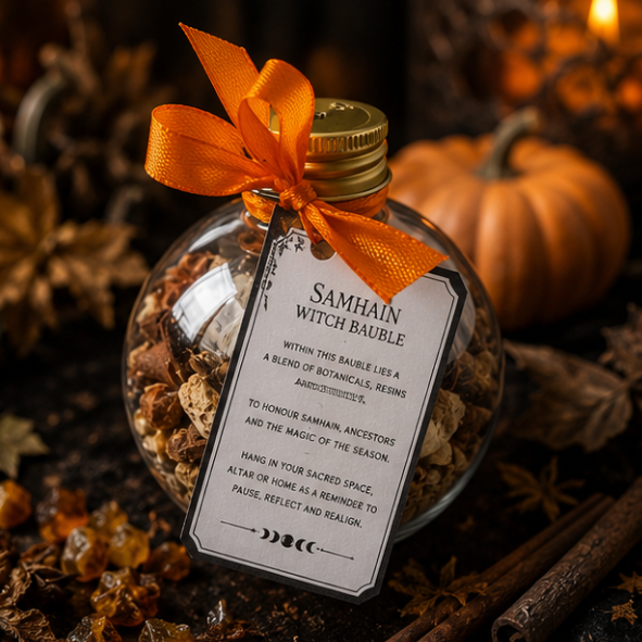 Samhain witch bauble with dried herbs, cinnamon and botanicals with Roaming Raven ritual tag