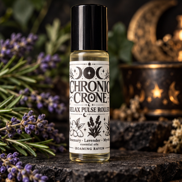 Chronic Crone Relax Pulse Roller bottle with a black cap and moon-themed label, photographed among lavender and rosemary.