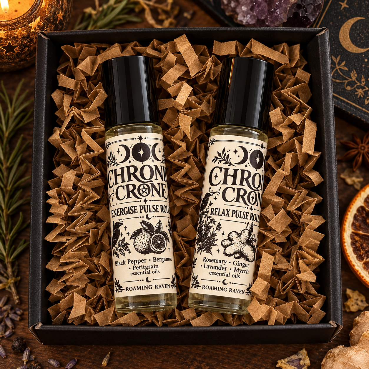Close-up of the Chronic Crone Energise and Relax pulse roller bottles in a black gift box with kraft paper filling.