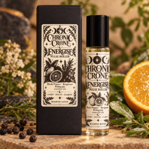 Chronic Crone Energise pulse roller bottle standing beside its black gift box, with matching moon and citrus labels.