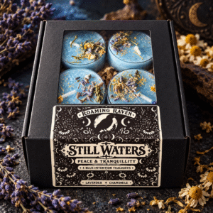 Angled view of a black Still Waters window box holding four blue herbal tealights beneath “A Little Ritual of Peace” lettering.